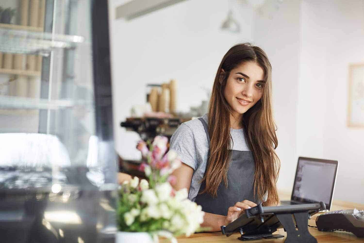 Cashier using AccuPOS in a grocery store