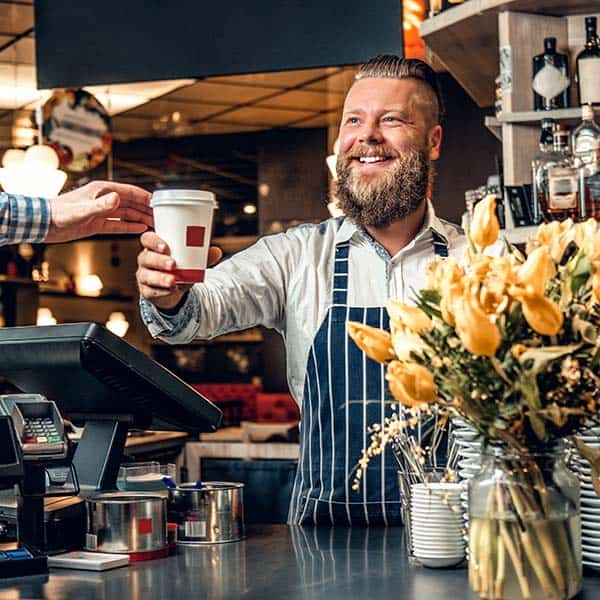 Retail employee using AccuPOS point of sale for store sales